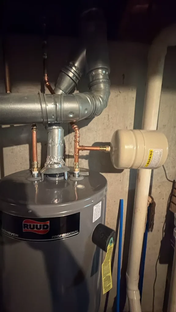 Ruud gas water heater with new copper connections and expansion tank